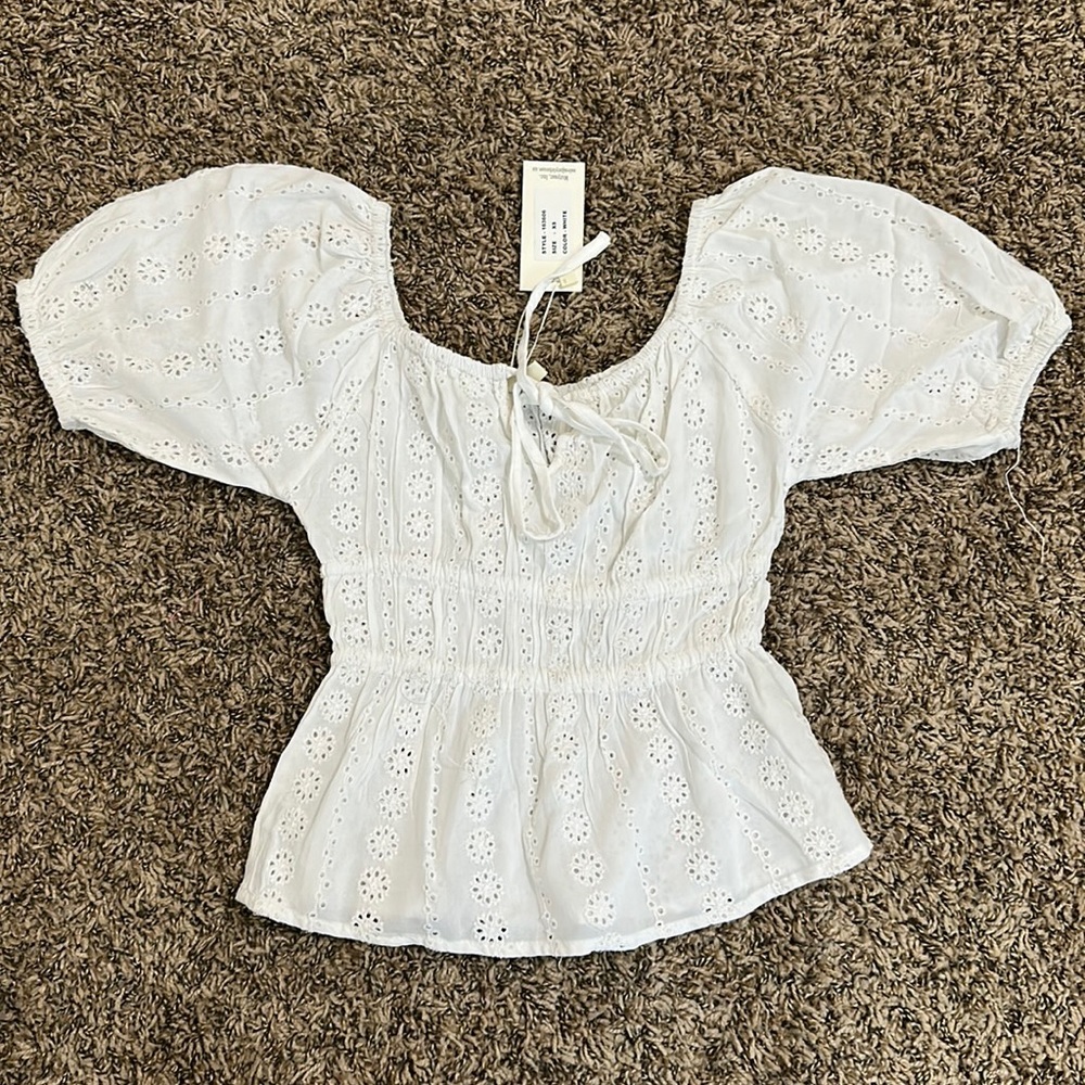 NWT white flowy ruffle top with flower eyelet embroidery